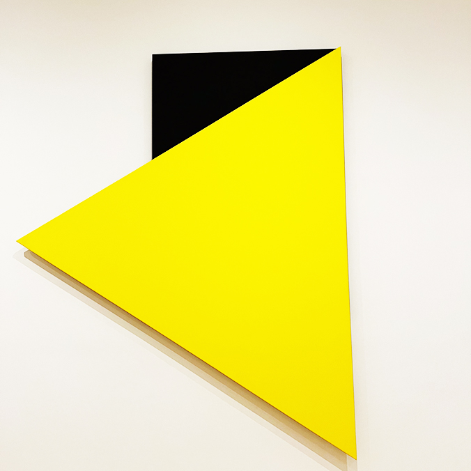 Artwork showing yellow triangle and black block
